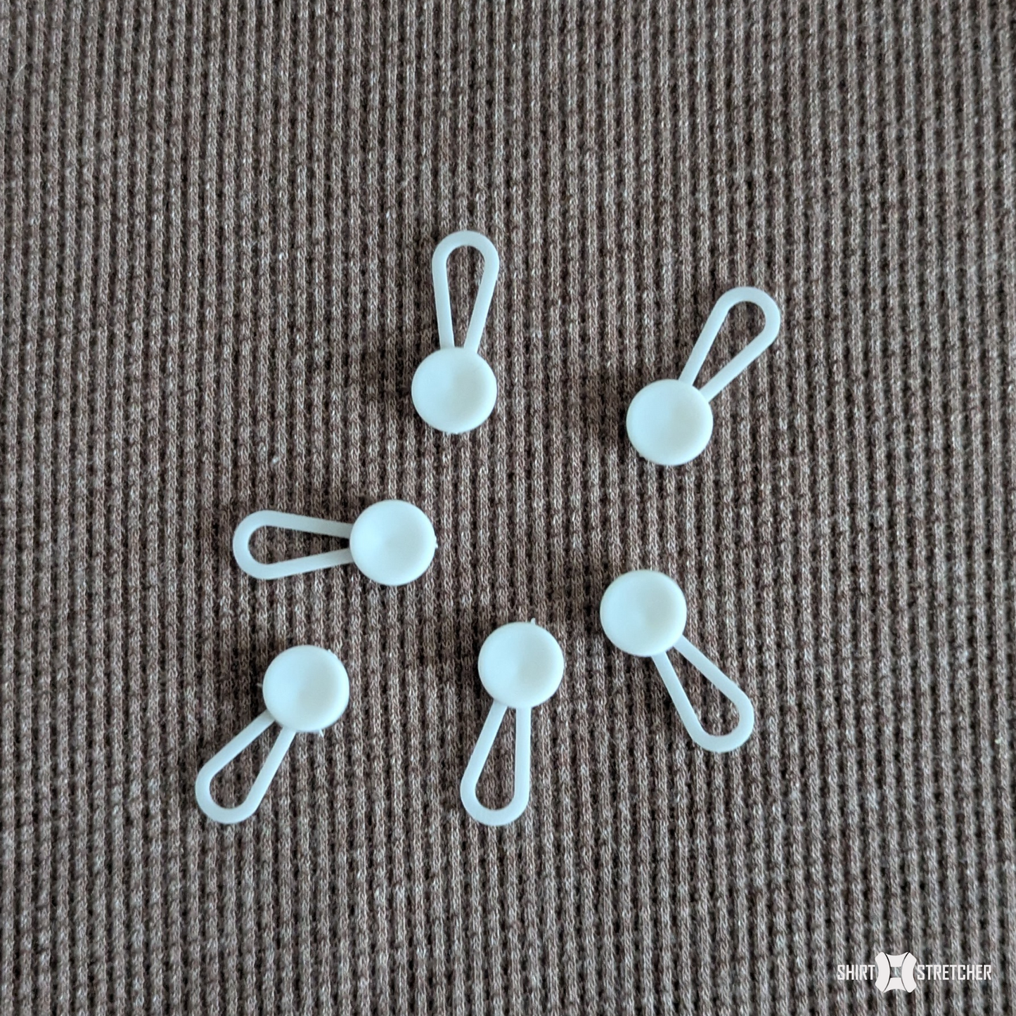 Classic White Collar Extenders on a cloth for display.