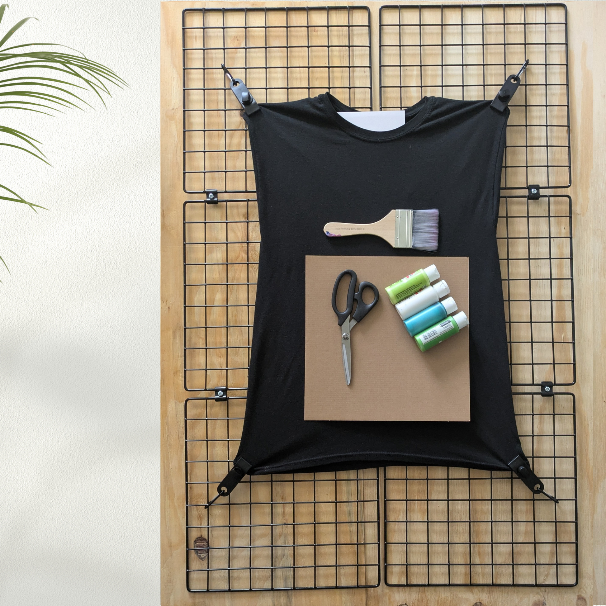Black shirt ready to be designed and painted with the Shirt Stretcher Crafting Frame