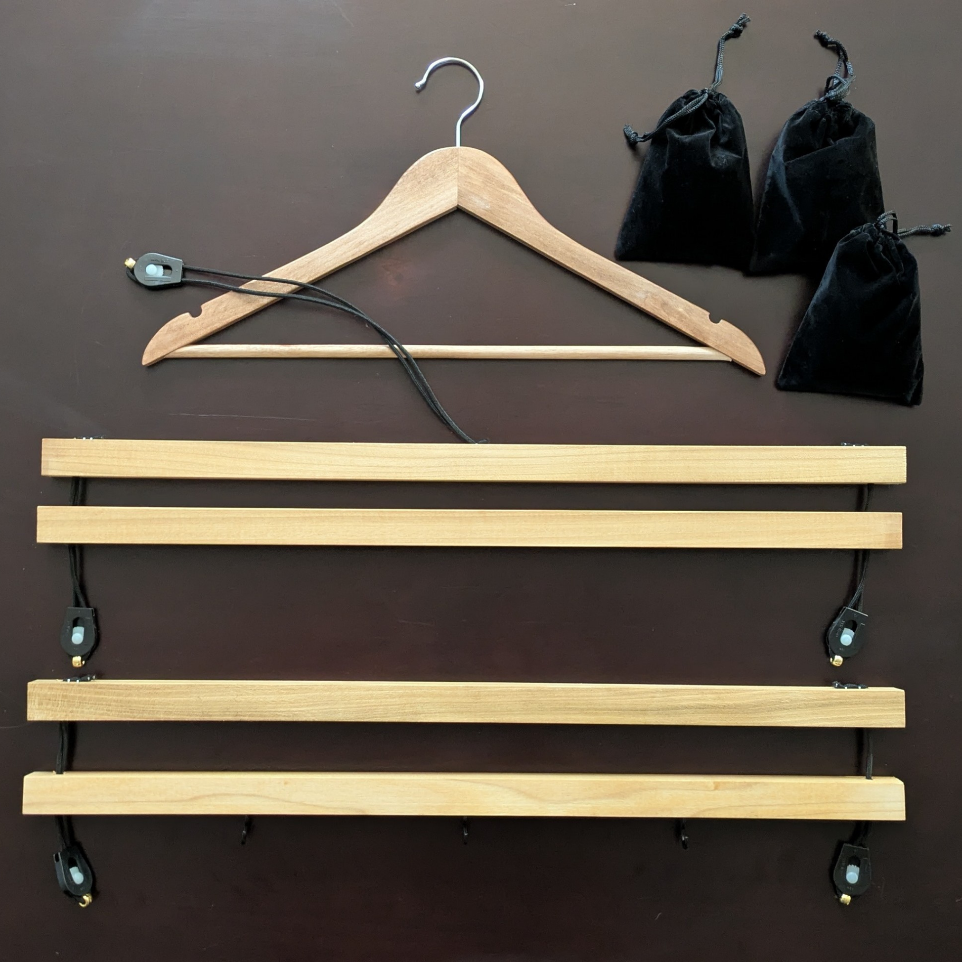 Shirt stretcher and accessories displayed on tabletop for detailed view