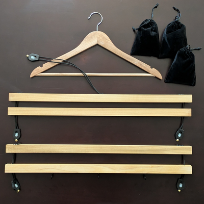 Shirt stretcher and accessories displayed on tabletop for detailed view